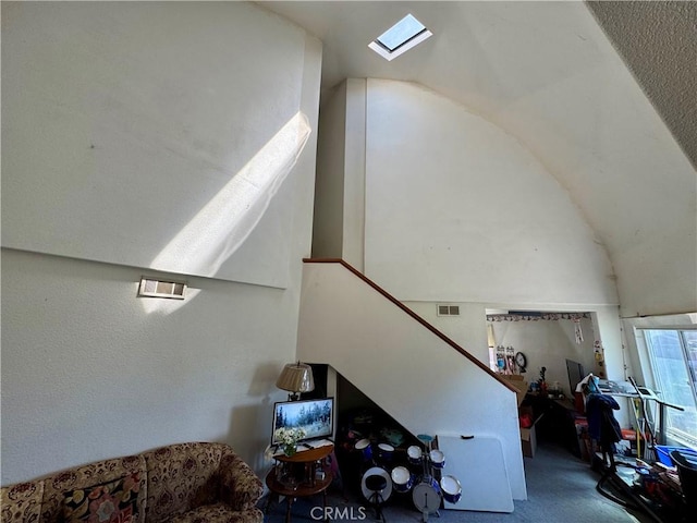 10265 Nancy Ave, Cherry Valley, CA 92223 - stairway with lofted ceiling, carpet flooring, and a skylight