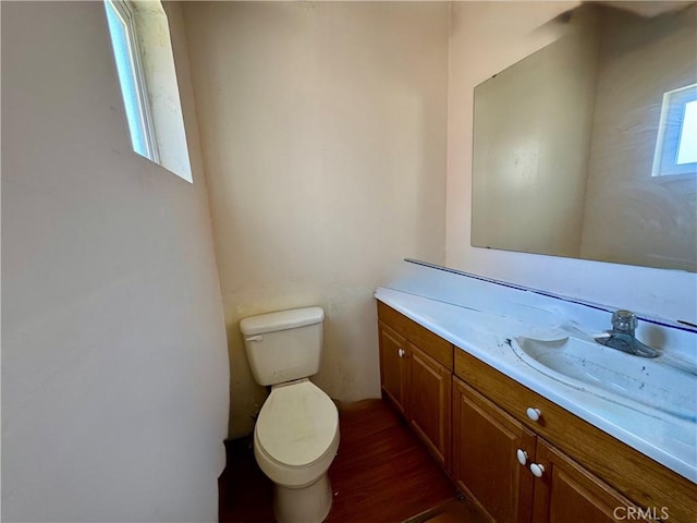 10265 Nancy Ave, Cherry Valley, CA 92223 - half bathroom with vanity, toilet, and wood finished floors