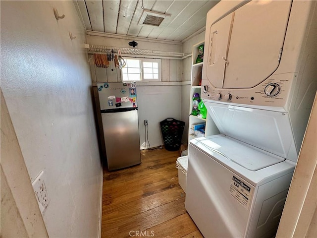 10265 Nancy Ave, Cherry Valley, CA 92223 - laundry room with stacked washer / drying machine, light wood-style flooring, and wooden ceiling