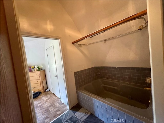 10265 Nancy Ave, Cherry Valley, CA 92223 - bathroom featuring a jetted tub and vaulted ceiling