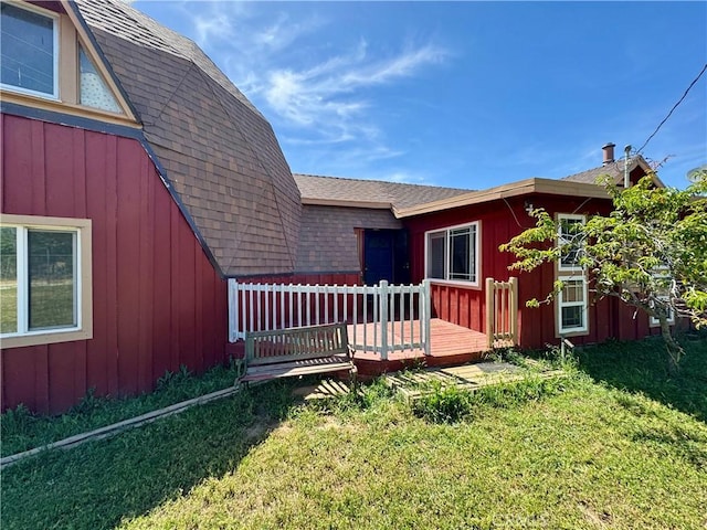 10265 Nancy Ave, Cherry Valley, CA 92223 - rear view of property with a wooden deck, a lawn, roof with shingles, and board and batten siding