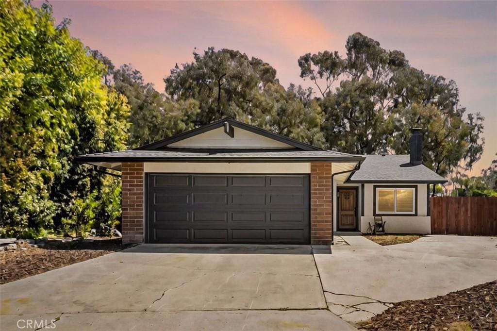 332 Cadillac Cir, Oceanside, CA 92054 - ranch-style home featuring driveway, brick siding, and a garage