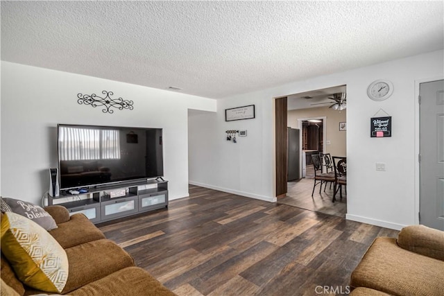 24438 Sage Ave, Boron, CA 93516 - living area with a textured ceiling, wood finished floors, baseboards, and a ceiling fan
