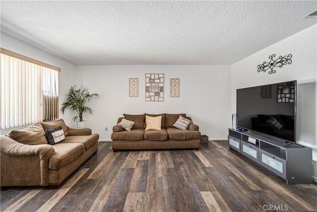 24438 Sage Ave, Boron, CA 93516 - living area with a textured ceiling, dark wood-style floors, and baseboards