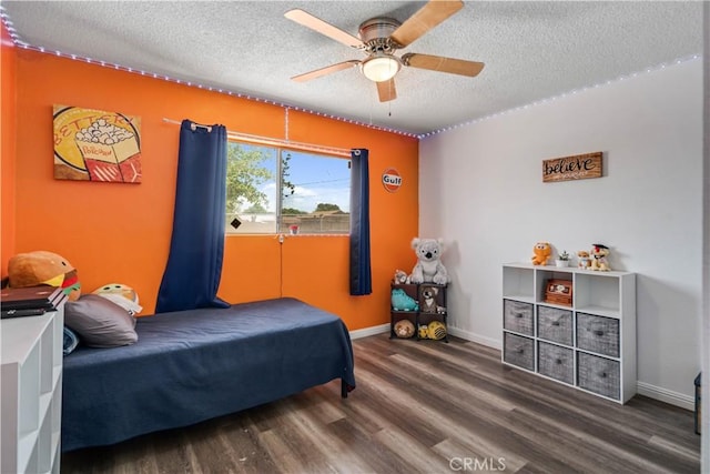 24438 Sage Ave, Boron, CA 93516 - bedroom featuring wood finished floors, a textured ceiling, ceiling fan, and baseboards