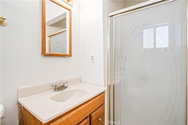 24438 Sage Ave, Boron, CA 93516 - full bathroom featuring vanity, toilet, and a shower stall