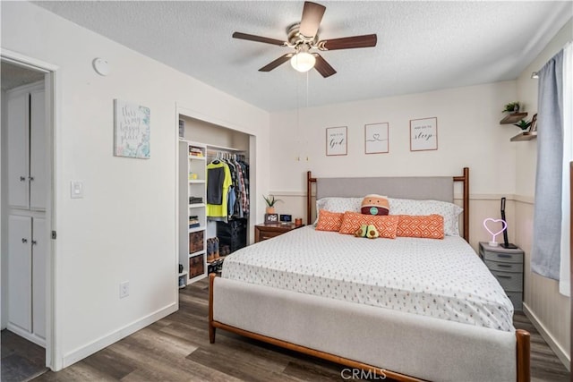 24438 Sage Ave, Boron, CA 93516 - bedroom featuring wood finished floors, a closet, a textured ceiling, and baseboards