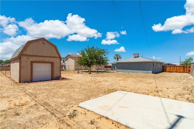 24438 Sage Ave, Boron, CA 93516 - view of yard with an outdoor structure, a barn, and a detached garage