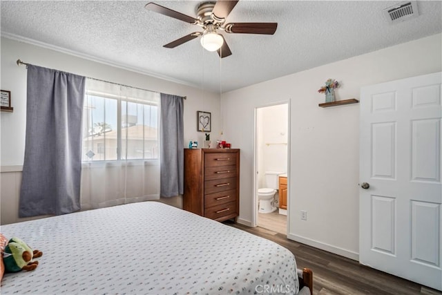 24438 Sage Ave, Boron, CA 93516 - bedroom featuring a textured ceiling, dark wood-style flooring, a ceiling fan, ensuite bathroom, and baseboards
