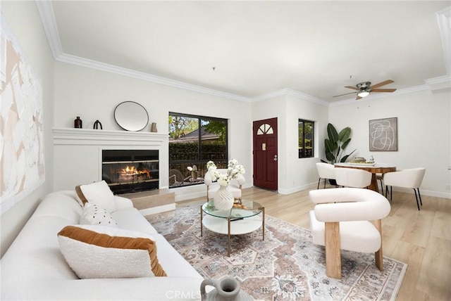 222 S Catalina Ave Unit 8, Pasadena, CA 91106 - living area with wood finished floors, ceiling fan, a tile fireplace, crown molding, and baseboards