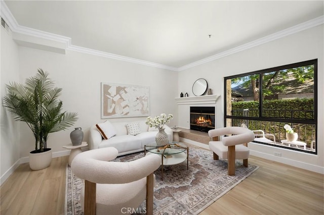222 S Catalina Ave Unit 8, Pasadena, CA 91106 - living area featuring crown molding, wood finished floors, a glass covered fireplace, and baseboards