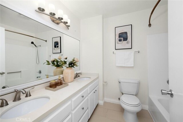 222 S Catalina Ave Unit 8, Pasadena, CA 91106 - bathroom featuring bathing tub / shower combination, toilet, double vanity, tile patterned floors, and baseboards