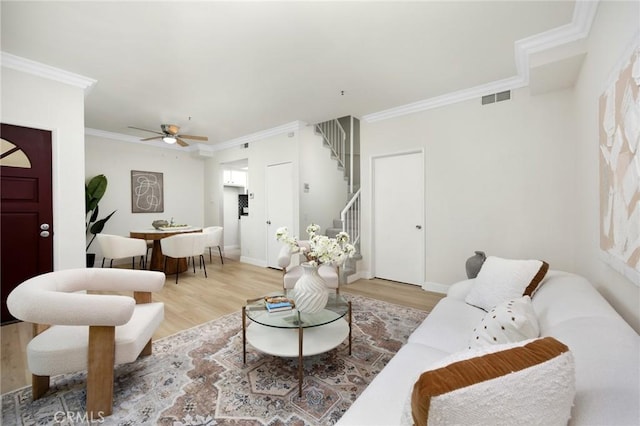 222 S Catalina Ave Unit 8, Pasadena, CA 91106 - living area featuring stairs, light wood-style floors, crown molding, a ceiling fan, and baseboards