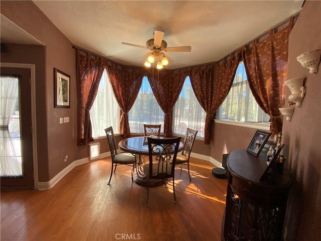 7614 Calpella Ave, Hesperia, CA 92345 - dining space featuring wood finished floors, a ceiling fan, baseboards, and a textured ceiling