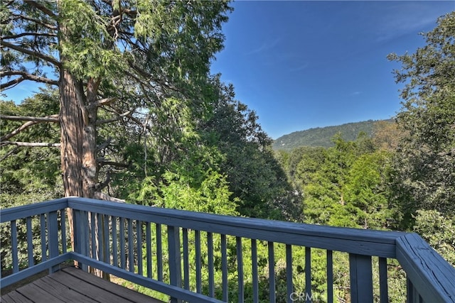 197 Weisshorn Dr, Crestline, CA 92325 - wooden terrace featuring a wooded view