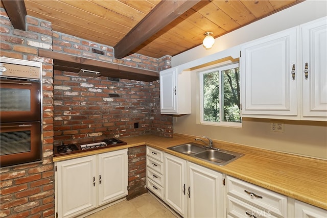 197 Weisshorn Dr, Crestline, CA 92325 - kitchen featuring gas cooktop, a wooden ceiling with exposed beams, double oven, white cabinetry, and light countertops