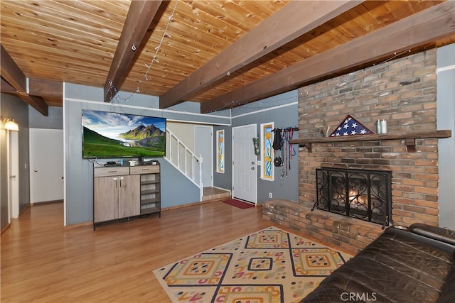 197 Weisshorn Dr, Crestline, CA 92325 - living area with stairway, wood ceiling with exposed beams, wood finished floors, and a fireplace