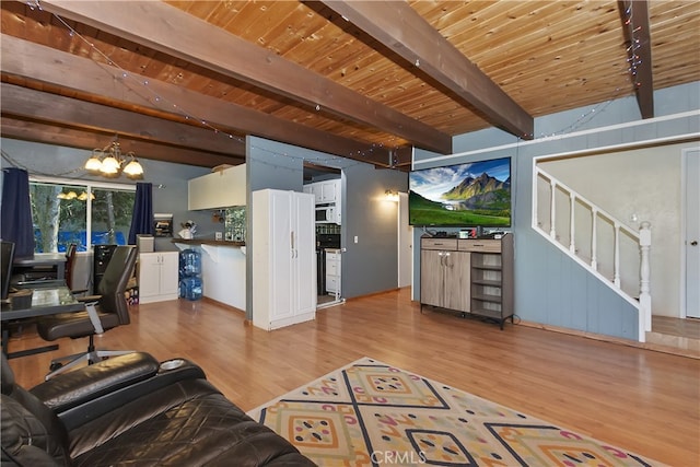 197 Weisshorn Dr, Crestline, CA 92325 - living room with a chandelier, wood finished floors, wooden ceiling, and stairway