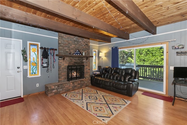 197 Weisshorn Dr, Crestline, CA 92325 - living room with wood finished floors, wooden ceiling with exposed beams, and a fireplace