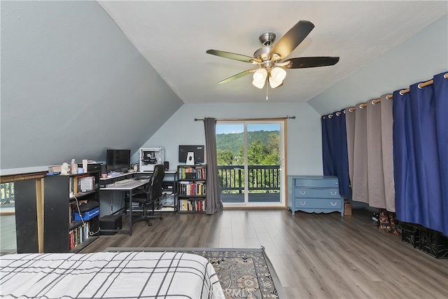 197 Weisshorn Dr, Crestline, CA 92325 - bedroom featuring access to exterior, wood finished floors, vaulted ceiling, a desk, and ceiling fan