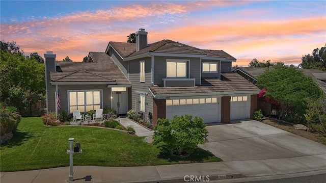 3184 Holloway Ct, Newbury Park, CA 91320 - traditional home featuring driveway, a chimney, a lawn, an attached garage, and a tile roof