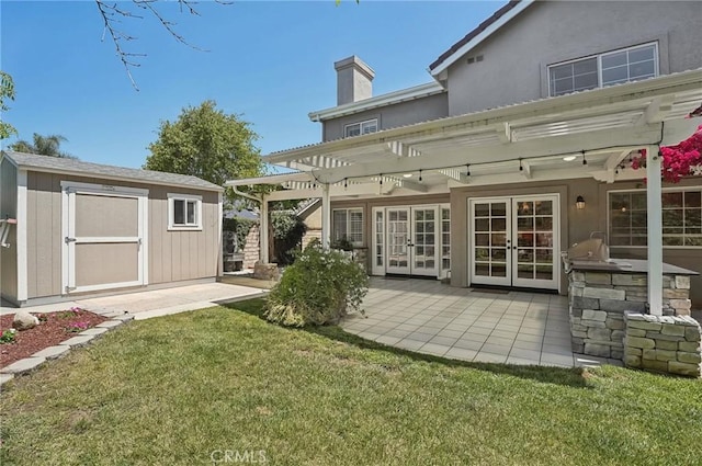 3184 Holloway Ct, Newbury Park, CA 91320 - rear view of house with french doors, a pergola, a chimney, a yard, and a patio