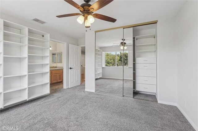3184 Holloway Ct, Newbury Park, CA 91320 - unfurnished bedroom with baseboards, carpet floors, a closet, and ceiling fan