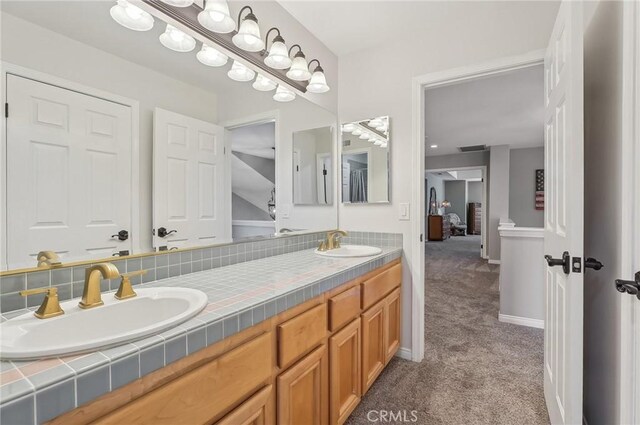 3184 Holloway Ct, Newbury Park, CA 91320 - bathroom with double vanity and baseboards