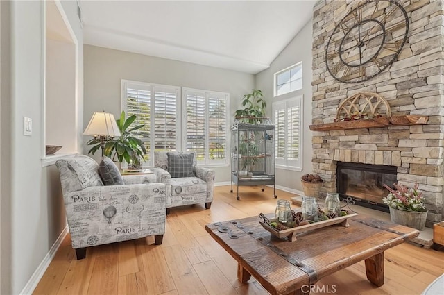 3184 Holloway Ct, Newbury Park, CA 91320 - living room featuring light wood-style flooring, baseboards, a fireplace, and high vaulted ceiling