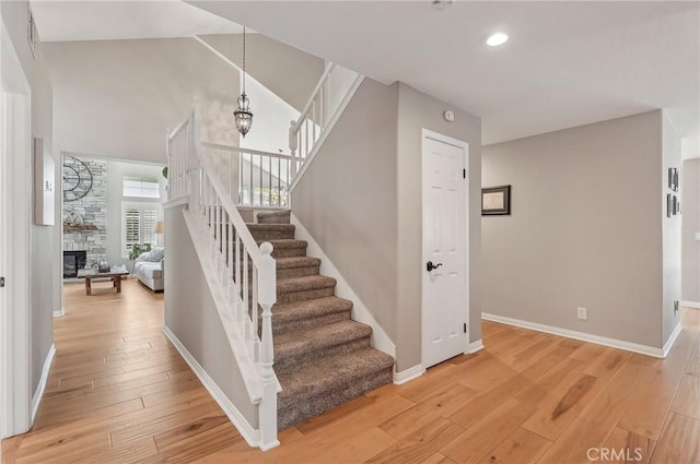 3184 Holloway Ct, Newbury Park, CA 91320 - stairway with wood finished floors, baseboards, recessed lighting, and a fireplace