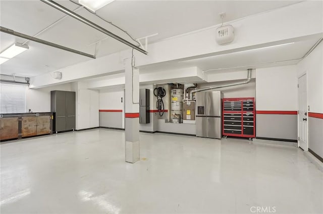 3184 Holloway Ct, Newbury Park, CA 91320 - garage featuring stainless steel fridge with ice dispenser and strapped water heater
