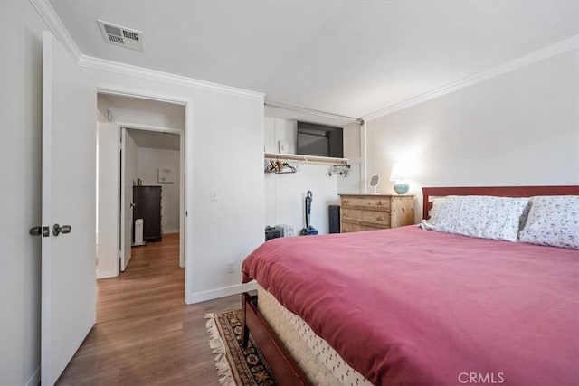 508 Woodland Dr, Los Osos, CA 93402 - bedroom with ornamental molding, wood finished floors, and baseboards