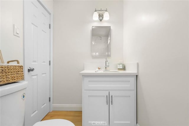 208 W Caldwell St, Compton, CA 90220 - bathroom with vanity and wood finished floors