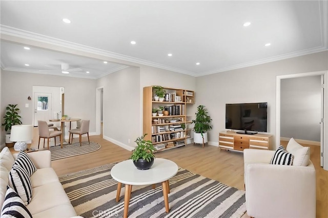 208 W Caldwell St, Compton, CA 90220 - living room featuring light wood-style flooring, recessed lighting, baseboards, and crown molding