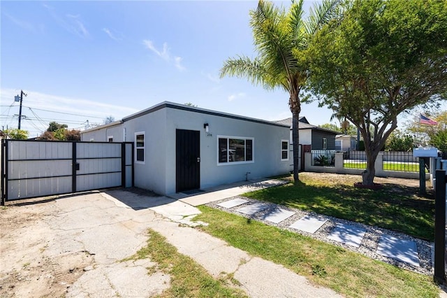 208 W Caldwell St, Compton, CA 90220 - view of front of property featuring a gate and stucco siding