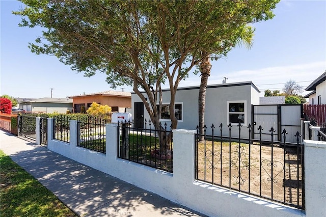 208 W Caldwell St, Compton, CA 90220 - view of front of home featuring stucco siding and a fenced front yard