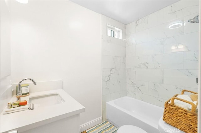 208 W Caldwell St, Compton, CA 90220 - bathroom with vanity, toilet, tub / shower combination, and baseboards