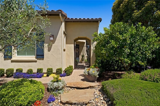 1494 Vista Tesoro Pl, Nipomo, CA 93444 - doorway to property featuring a gate, stucco siding, and a tiled roof