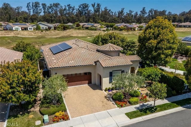 1494 Vista Tesoro Pl, Nipomo, CA 93444 - view of front of property with an attached garage, solar panels, stucco siding, driveway, and a residential view