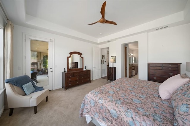 1494 Vista Tesoro Pl, Nipomo, CA 93444 - bedroom featuring light carpet, a tray ceiling, ceiling fan, and ensuite bath
