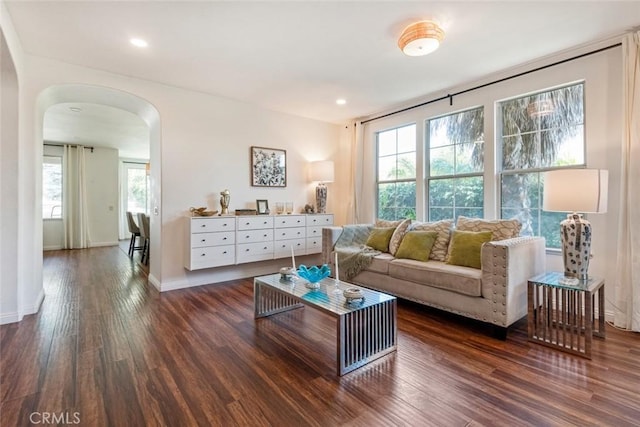 27636 Brentstone Way, Murrieta, CA 92563 - living room with arched walkways, dark wood-type flooring, baseboards, and recessed lighting