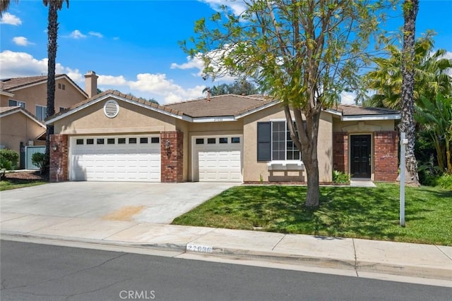 27636 Brentstone Way, Murrieta, CA 92563 - ranch-style home featuring brick siding, a garage, stucco siding, and a front lawn