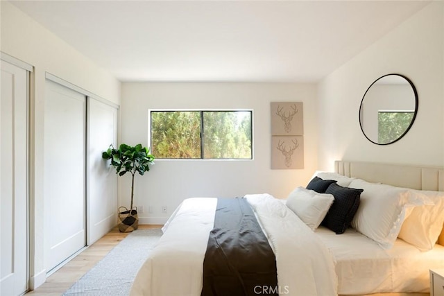 14803 Vanowen St Unit 9, Van Nuys, CA 91405 - bedroom with light wood-style floors and baseboards
