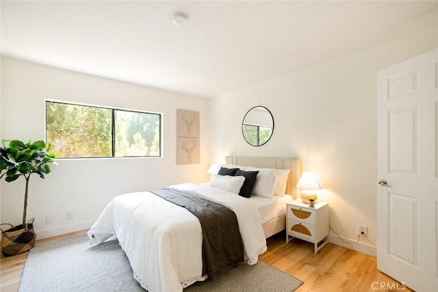 14803 Vanowen St Unit 9, Van Nuys, CA 91405 - bedroom featuring light wood finished floors and baseboards