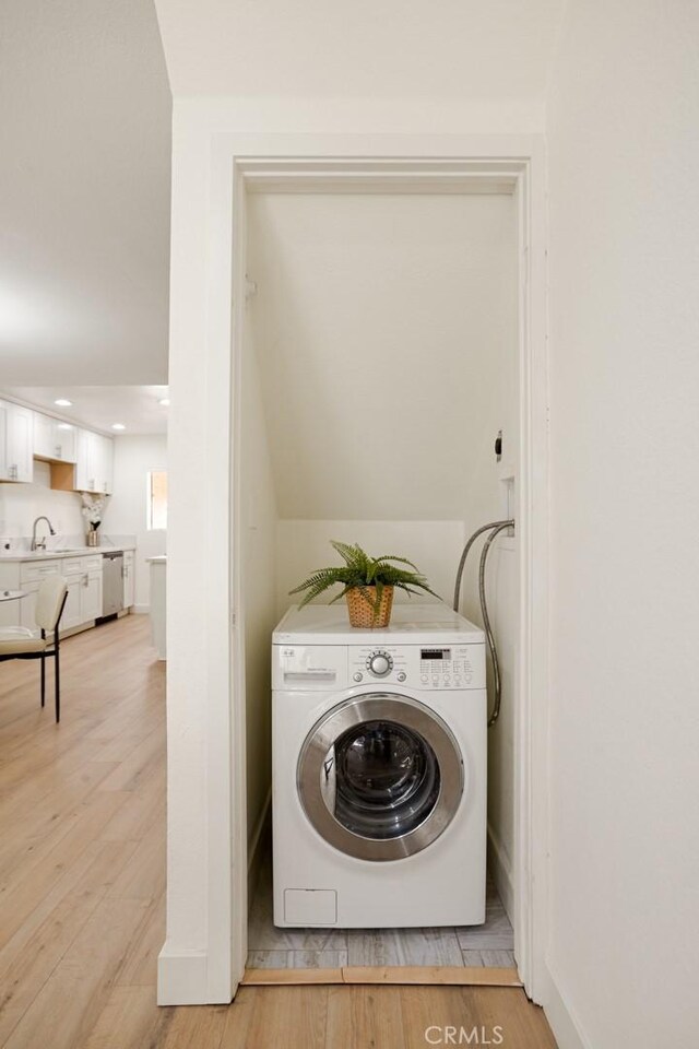 14803 Vanowen St Unit 9, Van Nuys, CA 91405 - laundry area featuring washer / dryer, light wood-style floors, recessed lighting, and baseboards