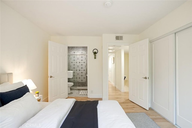 14803 Vanowen St Unit 9, Van Nuys, CA 91405 - bedroom featuring light wood-style flooring, a closet, and baseboards