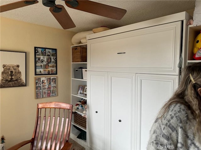 19251 Anaheim Ave Unit 1, Costa Mesa, CA 92627 - bedroom featuring ceiling fan and a textured ceiling