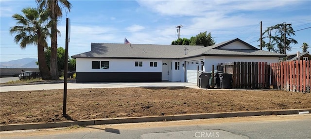 3355 Debbie Ln, Riverside, CA 92501 - single story home with an attached garage and stucco siding