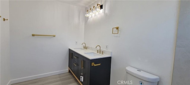 3355 Debbie Ln, Riverside, CA 92501 - bathroom with wood finished floors and double vanity