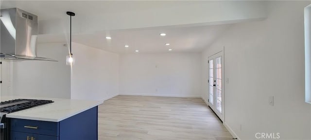 3355 Debbie Ln, Riverside, CA 92501 - kitchen with island range hood, blue cabinetry, light wood-type flooring, stainless steel range with gas cooktop, and recessed lighting